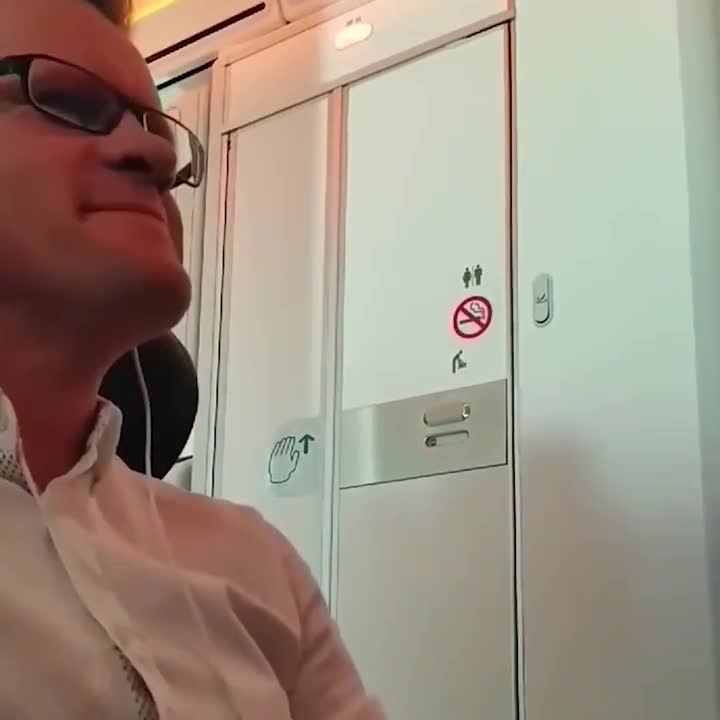Two passengers are leaving the toilet on a Virgin Atlantic flight. .. TFW