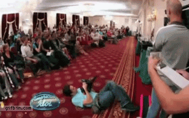 American Idol showoff FAIL. some guy tries to impress with backflips, ends up crushing the camerman!.