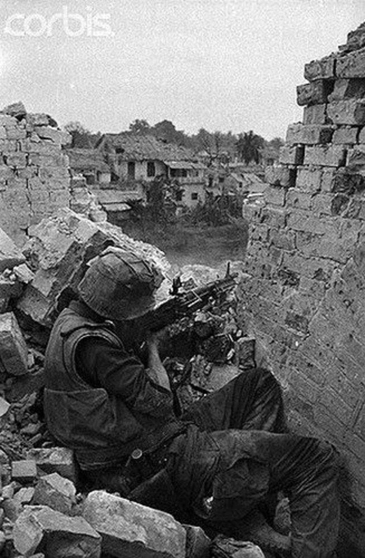 another vietnam comp 2. Aug 15, 1968. a hovercraft patrols at Tan My. Hue city, a US Marine uses a pillar for cover as he returns fire with his M40 sniper rifle