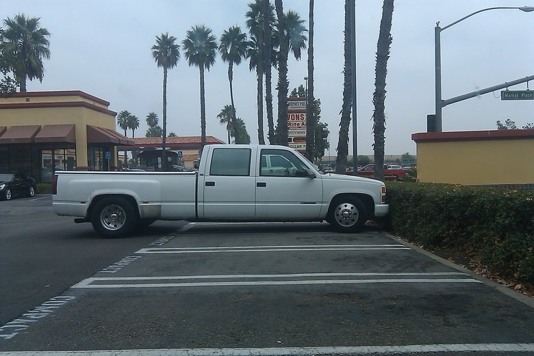 COMPACT PARKING FAIL. THIS n00b parked in compact parking!.. yea and I love asshats with over sized trucks park in a corner space and block me in due to the bed of the truck overlapping the space I'm in...assholes, the lo