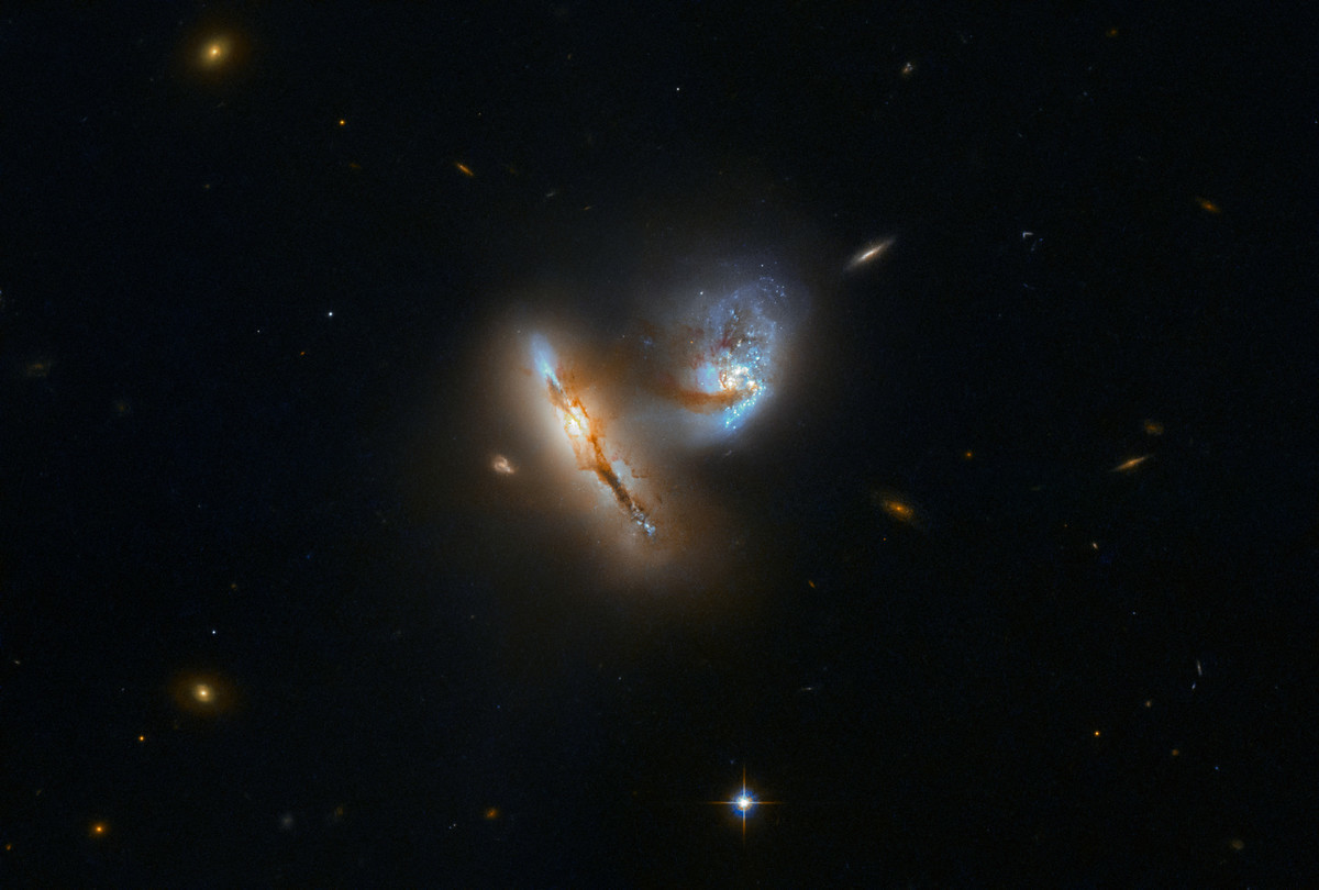 Hubble Telescope spots two galaxies flirting.. What looks like a delicate dance between two galaxies is actually a slow-motion collision of colossal proportions