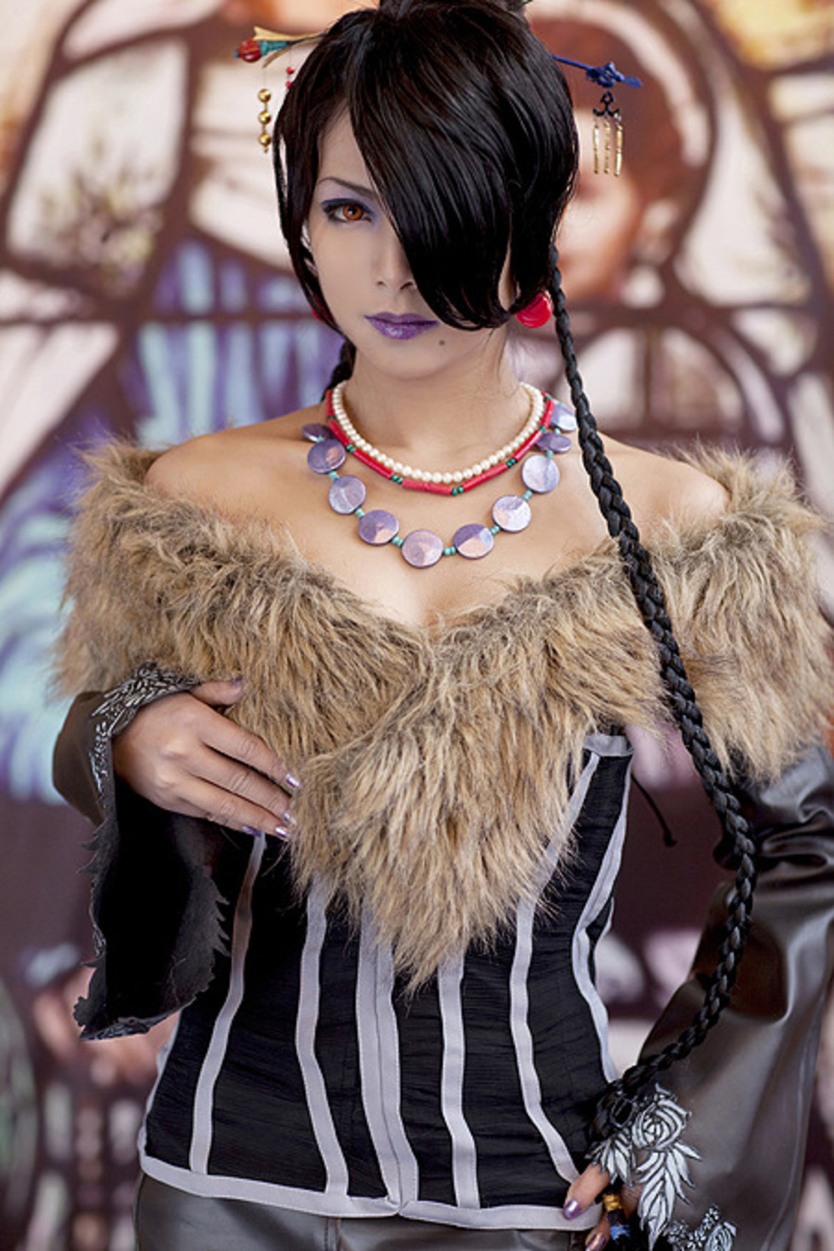 Lulu from Final Fantasy X cosplay. .. doesnt even show the lower part of the dress made of a million belts come on now the fashion is the best part of these characters