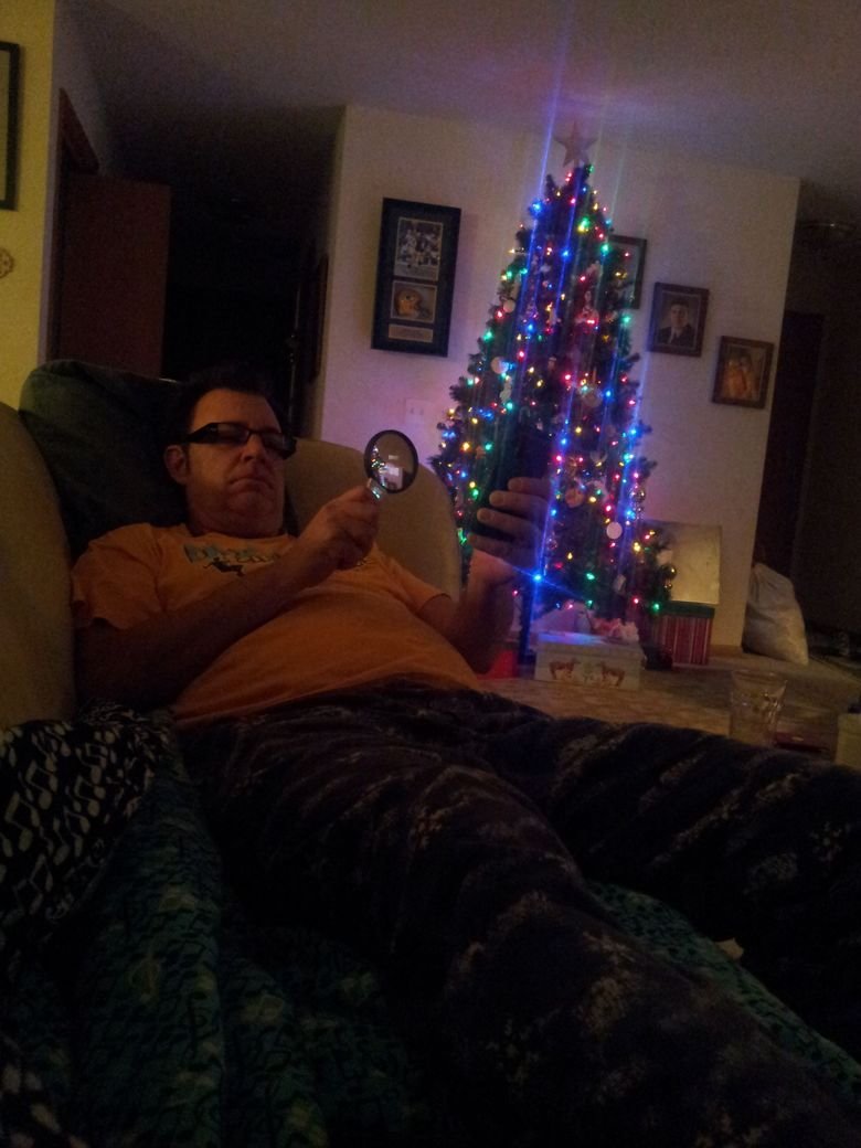 my dad using facebook mobile. .. Dude, somebody is trying to beam up your Christmas tree....