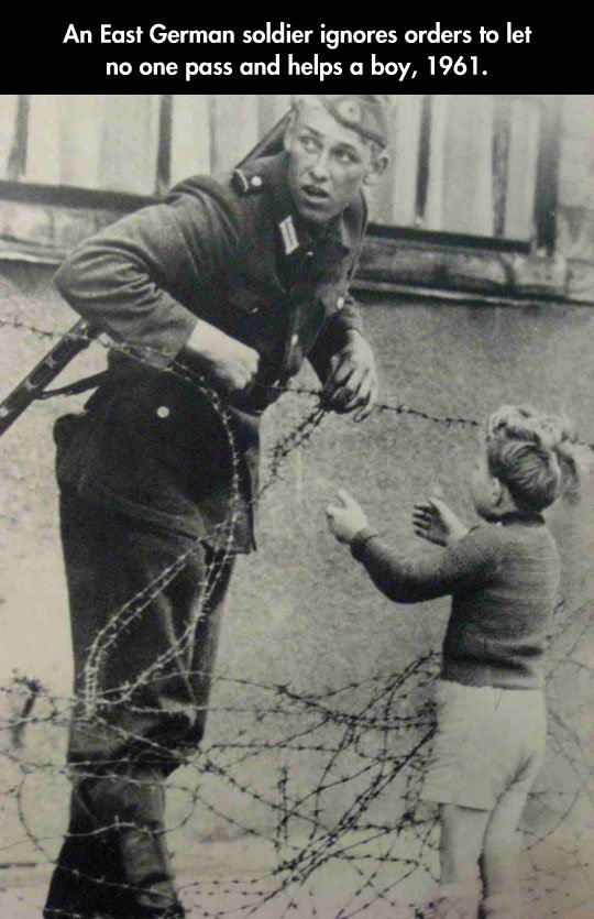 There’s Always Good People. There’s Always Good People In Both Sides Of a Conflict . An East German soldier ignores orders to let no one pass and helps in buy, 