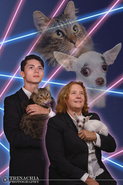 These two.. Principle takes a photo with a student who had been petitioning to get his photo with his cat into the yearbook as a way to raise awareness to stop 