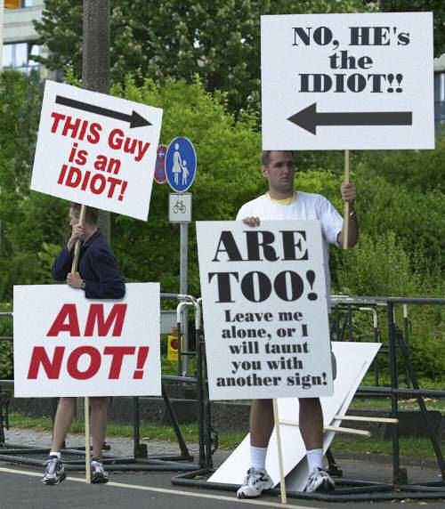 Two smart guys. Protesting against each other..