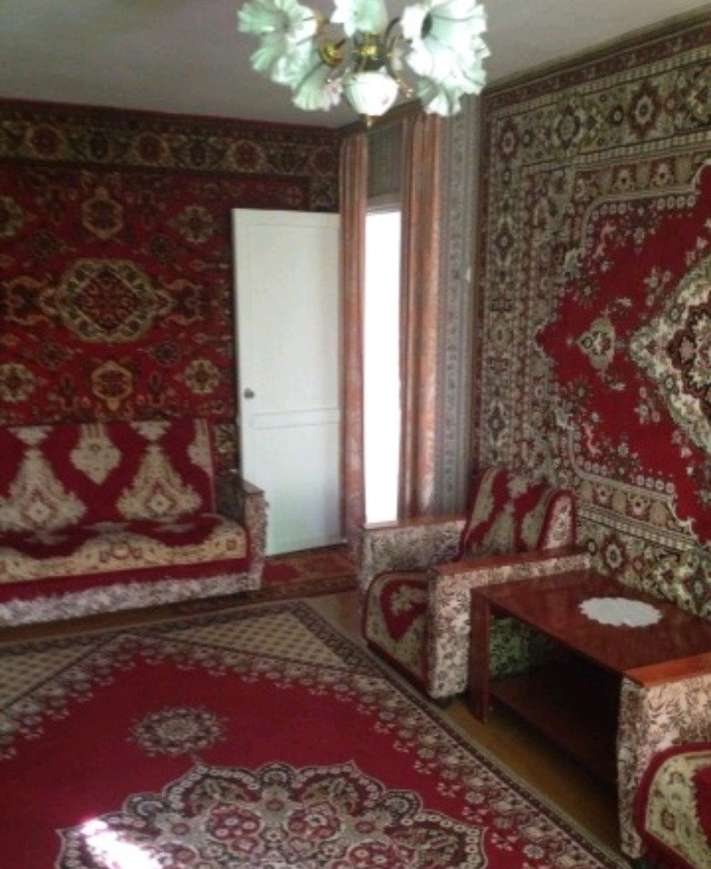 Typical ruskie house interior. Rugs...rugs never changes.. Really ties the place together