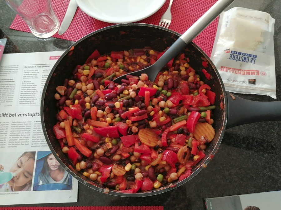 Vegetarian Chili. Made a chili out of bell peppers, beans, chickpeas, leftover vegetables, tomatoes and spices. Turned out delicious, especially with sour cream