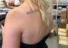 Her tattoo says "fresh spring rolls" in Thai