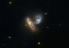 Hubble Telescope spots two galaxies flirting.